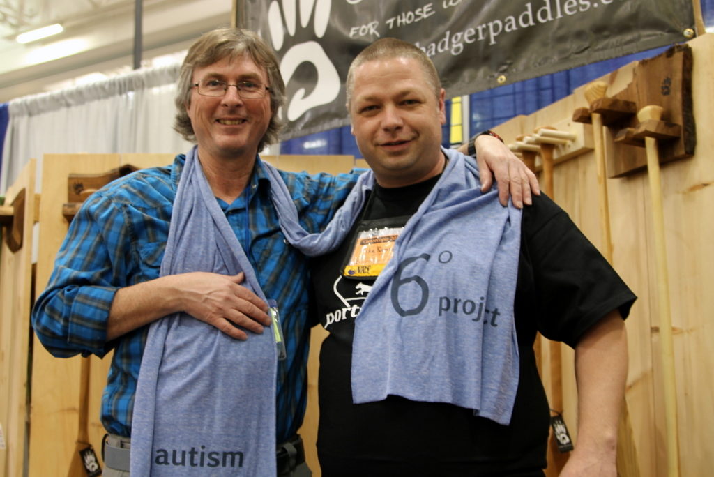 I finally tracked down Kevin, appropriately at the Badger Paddle booth. Pictured here with Mike, Kevin agreed to wear the blue scarf of the 6 degree project for Autism awareness.