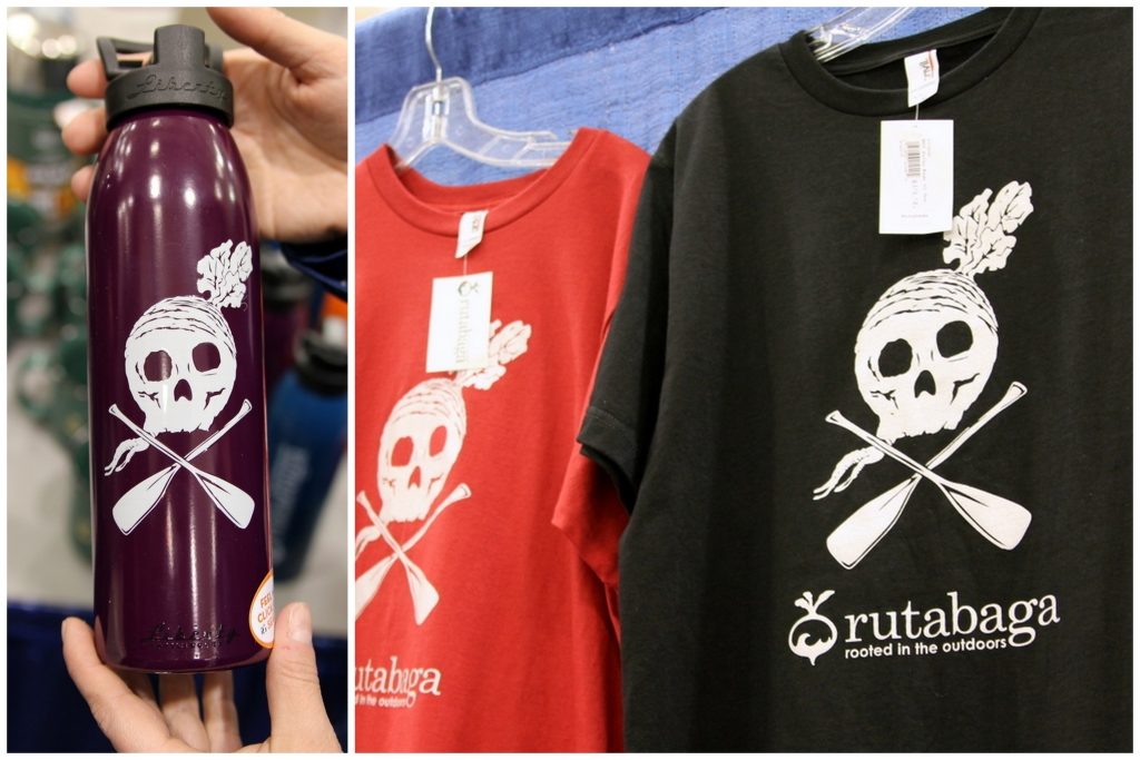 Rutabaga shows off it's pirate paddle logo on tshirts and water bottles.