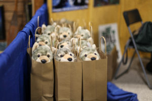Paper bags filled with stuffed animal wolves