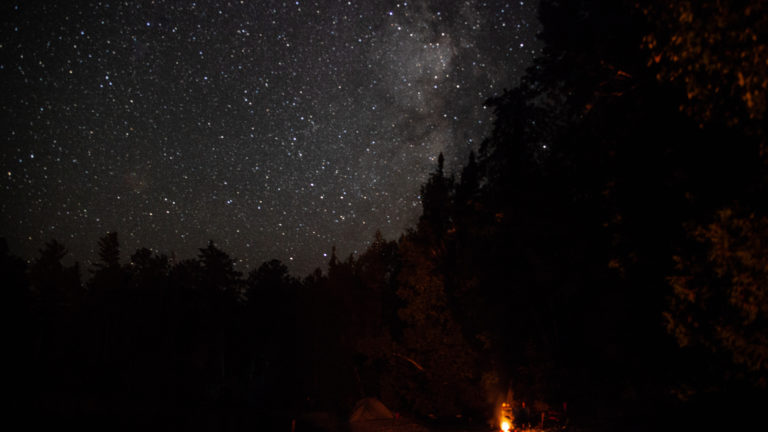 Milky way over a campfire