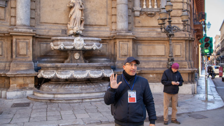 Domenico, a tour guide, speaks about the Quattro Canti, Palermo, Italy