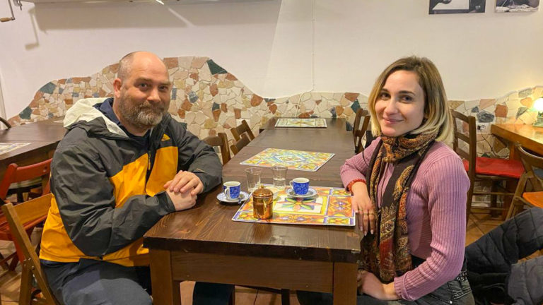 preston and maria sitting at a table on a coffee tour