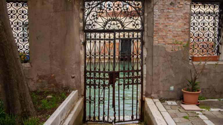 Gates at the canal of Chiesa di San Giorgio dei Greci, Venice, Italy
