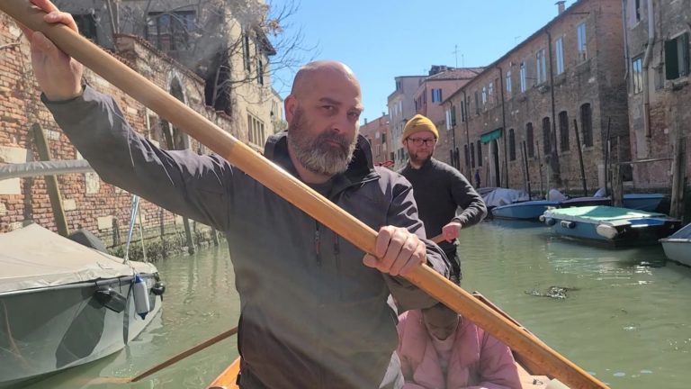 Preston rowing a gondola