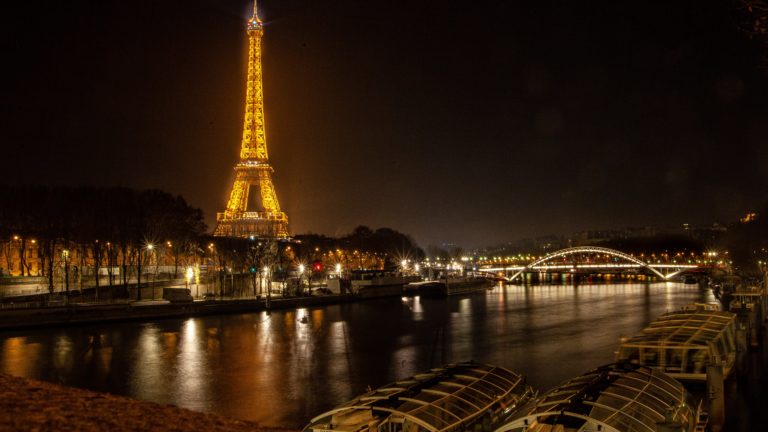 Eiffel Tower from the river at night, Paris, France